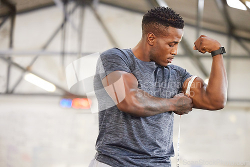 Image of Black man, tape measure and bicep with muscle and strong athlete, weightlifting and fitness in gym. Power, challenge and arm measurement, male person with exercise and bodybuilding with mockup space