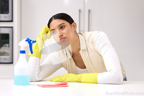 Image of Woman, cleaner is tired and sad or bored, unhappy with housework and housekeeping with chemical detergent spray. Spring cleaning, exhausted with female person in kitchen and housekeeper with burnout