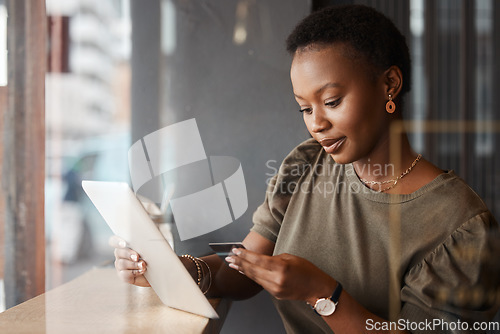 Image of Tablet, credit card code and black woman at a coffee shop with technology and ecommerce app. Online shopping, African female person and digital payment in a cafe and restaurant with tech and website