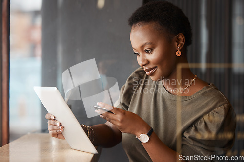 Image of Tablet, credit card and black woman at a coffee shop with technology and ecommerce app. Online shopping, African female person and digital payment in a cafe and restaurant with tech and website deal