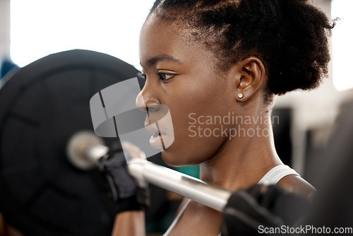 Image of Face, weightlifting and barbell with black woman in gym for workout, strong and muscle. Health, challenge and exercise with female bodybuilder and weights for focus, performance and commitment