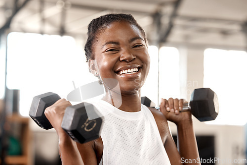 Image of Weightlifting, dumbbell and portrait with black woman in gym for workout, strong and muscle. Exercise, weights and sports equipment with female bodybuilder in fitness center for challenge and health