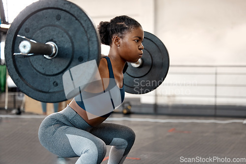 Image of Fitness, weightlifting and barbell with black woman in gym for workout, strong and muscle. Health, challenge and exercise with female bodybuilder and weights for focus, performance and commitment