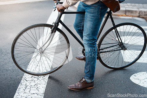 Image of Bicycle, travel and legs of business man on street for transport, commute and journey to work. City, traffic and male person on bike for eco friendly, carbon neutral and sustainability transportation