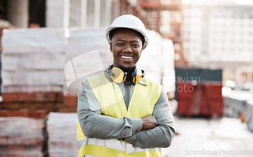 Image of Black man, portrait smile and arms crossed for construction, project management or architecture in city. Happy African male person, engineer or architect smiling in confidence for industrial building