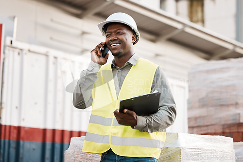 Image of Phone call, smile and black man engineer in construction site talking or in discussion to contact on mobile conversation. Industry, communication and worker planning architecture as a builder