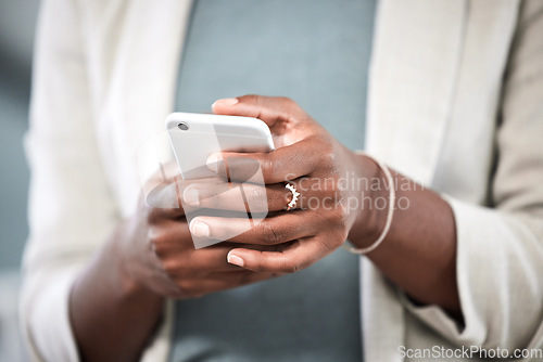 Image of Phone, hands and closeup of a businesswoman browsing on social media or the internet. Technology, communication and female employee typing or networking on a mobile app with a cellphone in workplace.