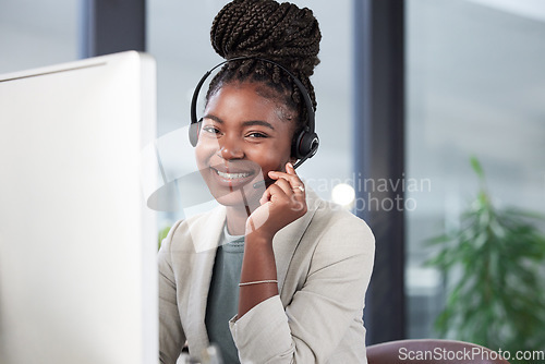 Image of Call center, portrait and black woman smile by computer for telemarketing, customer service or support. Contact us, face and sales agent, consultant or person from South Africa in business office.