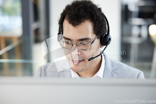 Image of Call center, computer and man work for telemarketing, customer service or support. Contact us, crm and male sales agent, consultant or employee working in help desk, business office and consulting.