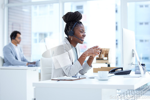 Image of Call center, woman and smile with headset and computer on desk for telemarketing or customer service. Black female consultant or agent reading email or online for crm, help desk or technical support