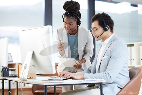 Image of Call center, coaching and black woman with employee on computer for learning customer service work. Training, tablet and man with mentor for telemarketing, teamwork or collaboration of sales agents.