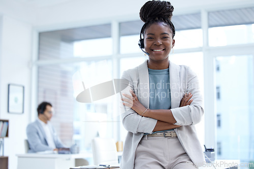 Image of Call center, customer support and portrait of black woman with crossed arms, confidence and smile for help. Telemarketing, professional and happy female consultant for crm service, sales and contact