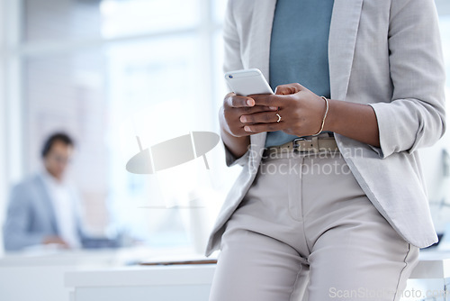 Image of Phone, office and closeup of a businesswoman networking on social media or the internet. Technology, professional and female employee typing for browsing on a mobile app with a cellphone in workplace