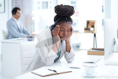 Image of Tired, stress and headache with black woman in call center office for fatigue, anxiety and burnout. Frustrated, mental health and glitch with female employee for communication and customer service