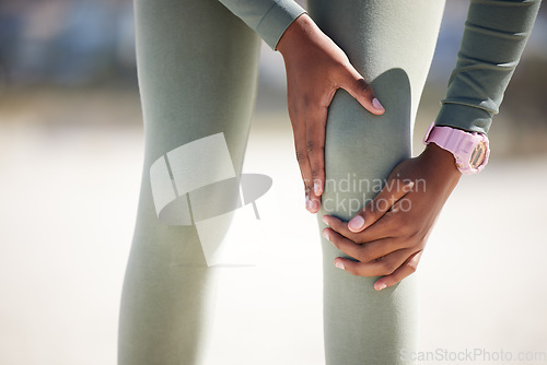 Image of Hands, knee injury and athlete outdoor with pain during exercise, running or training. Arthritis, fitness or leg of person with fibromyalgia, wound problem or emergency accident during sports workout