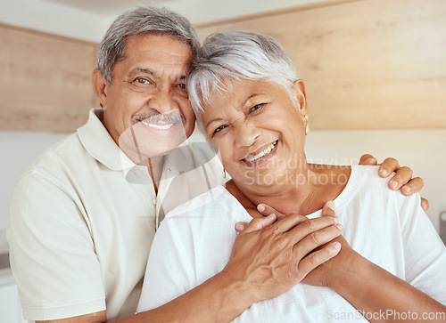 Image of Portrait, love and senior couple hug in a living room, happy and relax in their home together. Face, smile and holding hands by old people embrace, loving and enjoying retirement in their house