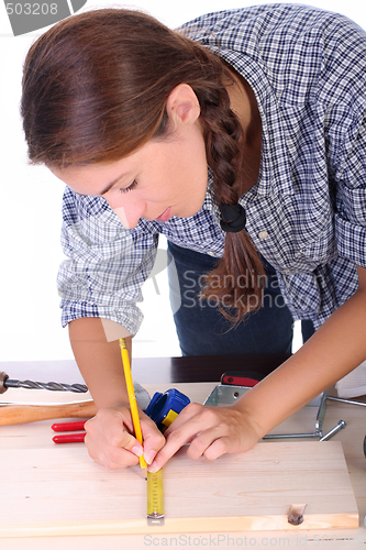 Image of woman carpenter at work 