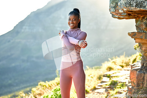 Image of Black woman, mountain hiking and portrait for exercise, stretching and warm up for wellness with smile in summer. African girl, workout and training in sunshine with happiness for fitness adventure