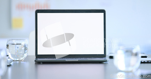 Image of Laptop screen, mockup and boardroom of a tech company at a desk with digital presentation. Internet, web slides and technology with a computer for business meeting and workshop with sales data