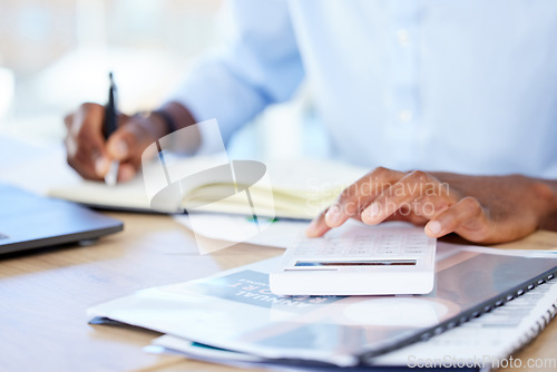 Image of Business, closeup and black man with a calculator, writing and notebook with planning, finance and budget. Male person, accountant and employee with documents, paperwork and folders with numbers