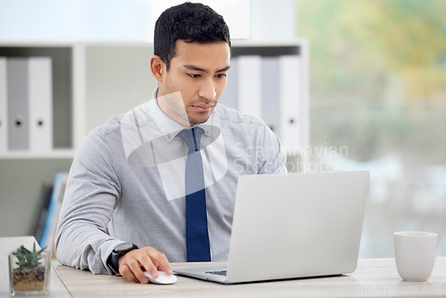 Image of Business, employee and man with a laptop, focus and typing with connection, network and thinking. Male person, consultant or agent with a pc, technology and professional with concentration and career