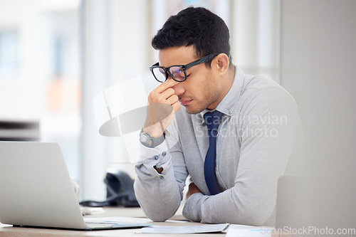 Image of Stress, headache and business man on laptop for debt review, financial mistake and company crisis or fail. Computer, online taxes and audit employee, accountant or person with depression or problem