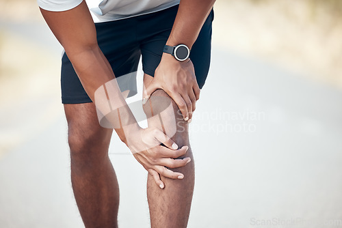 Image of Running, knee pain and closeup of man in city for inflammation, accident and emergency. Fitness, workout and training with legs of male runner in road for muscle ache, sports injury and first aid