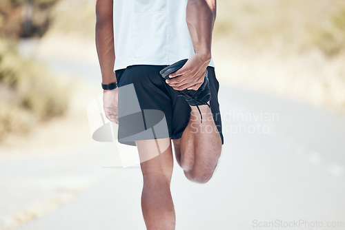 Image of Stretching, running and closeup of man in road for training, workout and exercise. Muscle, fitness and cardio performance with legs of male runner and warm up in nature for marathon, start and health