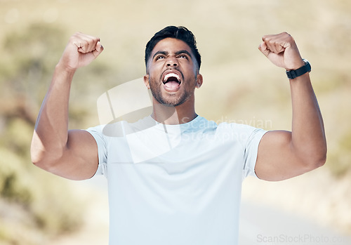 Image of Man, fitness and fist in celebration for winning, achievement or workout exercise and training in nature outdoors. Happy and excited male person, athlete or runner in joy for cardio, win or victory