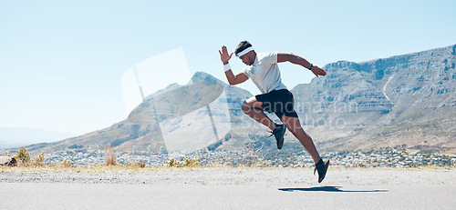 Image of Man, fitness and mountain running on road for cardio workout, training or exercise banner in nature. Fit, active or sport male person, athlete or runner exercising on asphalt street with mockup space