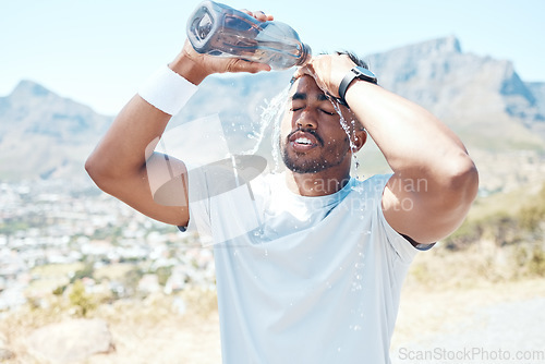 Image of Pour water, fitness and face of man on mountain for exercise, marathon training and running. Sports, nature and male person refresh with liquid for wellness, cardio workout and hydration to cool down