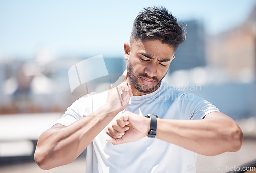 Image of Man, fitness and checking watch for pulse, heart rate or performance after running exercise in city. Fit, active and sporty male person, athlete or runner looking at wristwatch for monitoring in town
