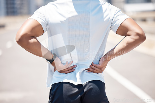 Image of Back pain, sport injury and person with muscle, inflammation and accident from fitness. Outdoor, athlete and injured joint in spine from workout, exercise and training on road for wellness and health