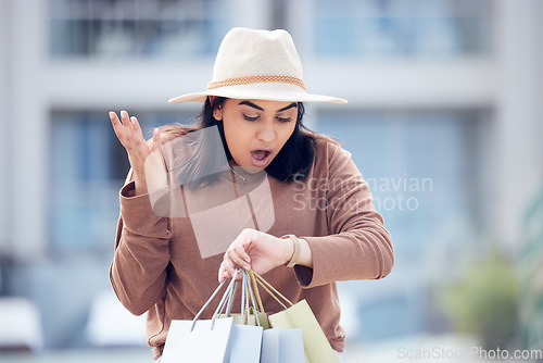 Image of Shopping, time and Indian woman late in city with bag for time management, rushing and hurry. Retail, fashion and female person check watch with bags from sale, bargain and discount purchase in town