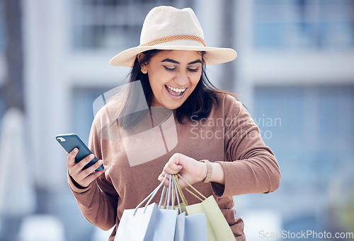 Image of Shopping, time and Indian woman with phone in city with bag for adventure, rushing and hurry. Retail, fashion and female person check watch with bags from sale, bargain and discount purchase in town