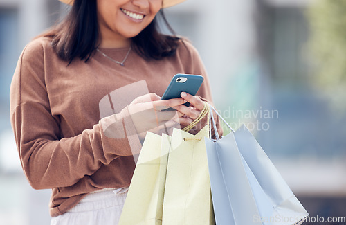 Image of Shopping, phone and woman typing in city with bag online for sale notification, social media and internet. Retail, fashion and happy female person on smartphone for chat, mobile app and website sale