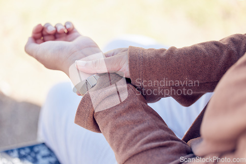 Image of Heart rate, pulse and hand of woman in outdoors for blood pressure, healthcare and diagnosis. Monitor, results and tracking with closeup of female person wrist for progress, medical and check