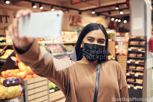 Image of Selfie, phone and woman with a mask supermarket for social media, internet or web while shopping for food. Grocery, covid and young customer taking picture on a mobile or smartphone in a shop