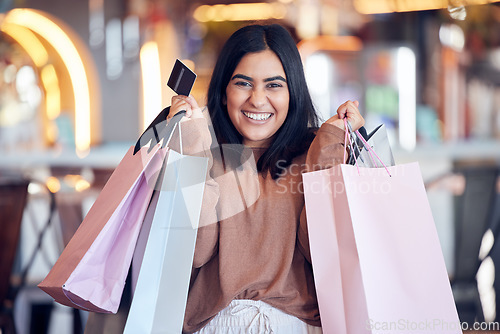 Image of Portrait, excited and woman with a credit card, shopping and bags with transactions, fashion and boutique clothes. Face, female person and customer with fashion, deal or retail with products or items