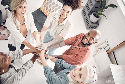 Image of Teamwork, hands together and portrait of business people with smile, support and trust from above. Design team, coworking and hand circle in office, happy employees with cooperation and diversity.