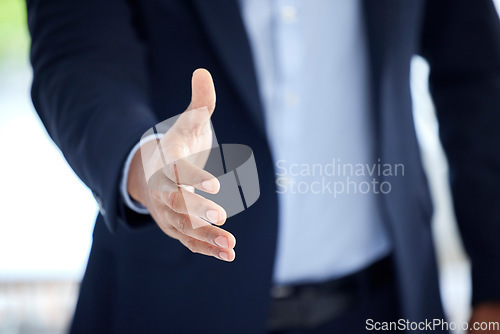 Image of Business, man and hand with negotiation in closeup for an interview with entrepreneur at a company. Professional male, welcome and meeting with an offer with trust and support for hiring at office.