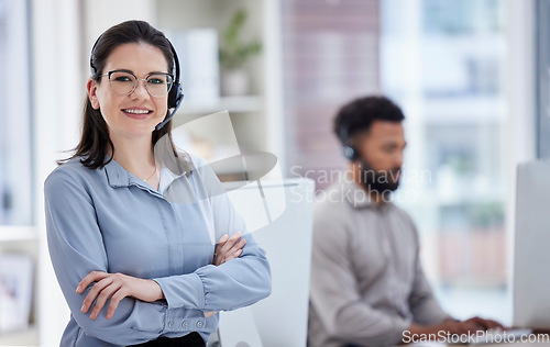 Image of Call center, customer support and portrait of woman with crossed arms in office for CRM help. Professional, telemarketing and happy female worker with headset for contact, support and consulting