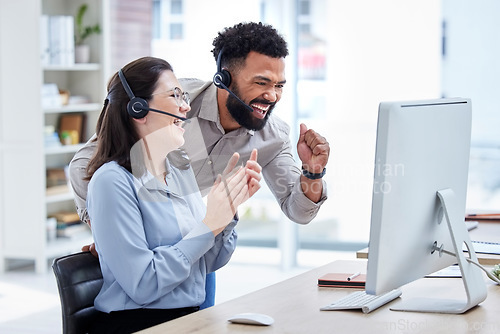 Image of Computer, call center and people winning, success and celebration of target, sales and online profit in telecom. Telemarketing agency, team or woman and man celebrate, applause and yes for bonus