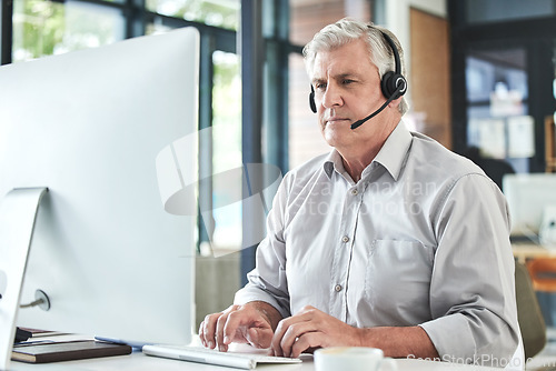 Image of Mature, contact us and call center writing of a professional at a computer for telemarketing job. Senior expert, web support and consultation of male person at desk for business and customer service.