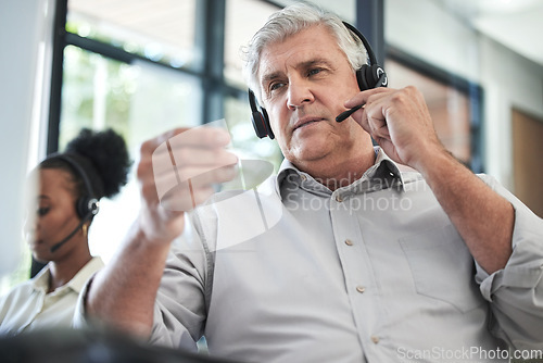 Image of Call center, customer support and senior man with headset in office for help, talking and telemarketing. Communication, manager and elderly male worker for contact us, crm service and consulting