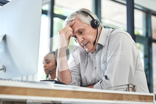 Image of Stress, callcenter manager and man with headache in customer service agency with pain or crisis. Communication fail, senior management with computer or help desk consultant with problem on phone call