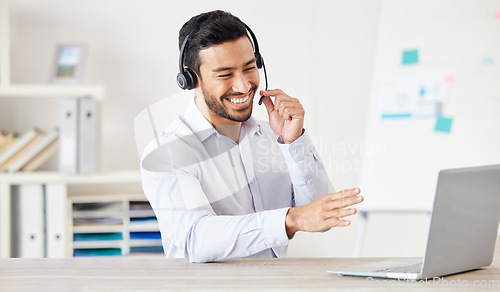 Image of Telemarketing, man with a headset and laptop at his desk of a modern office workstation. Consultant or online communication, crm or customer service and male call center agent happy at workplace