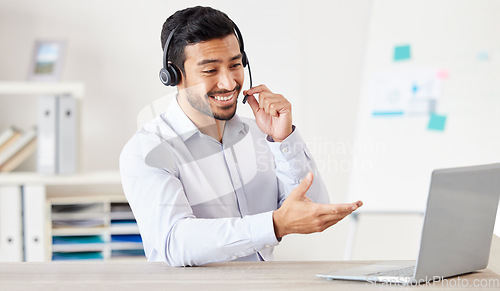 Image of Consultant, man with a headset and laptop at his desk of a modern office workplace. Telemarketing or customer service, crm or online communication and male call center agent happy at workstation