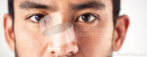 Image of Closeup, portrait and man with eyes, vision and looking forward with sight, see and clear optics. Face, male person or model with eyesight, zoom or eyecare with health, wellness or staring with focus