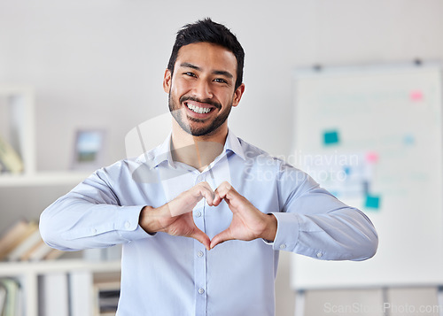 Image of Heart hands, smile and portrait of man in office with ideas and happiness for future start up project. Businessman, love hand sign or emoji for excited business deal, service and care with kindness